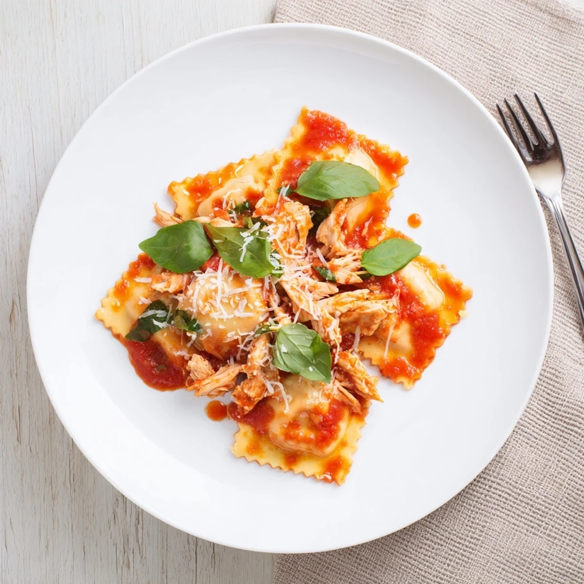 Delicate handcrafted ravioli filled with seasoned chicken mushrooms and draped in aromatic tomato sauce