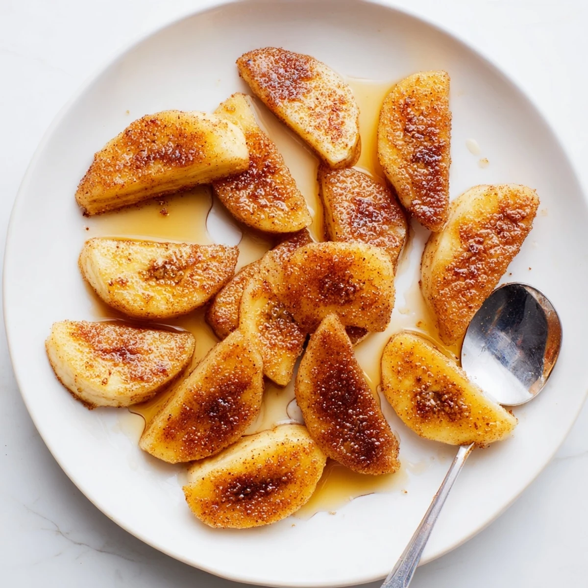 Sweet pan fried cinnamon bananas topped with brown sugar and cinnamon dust