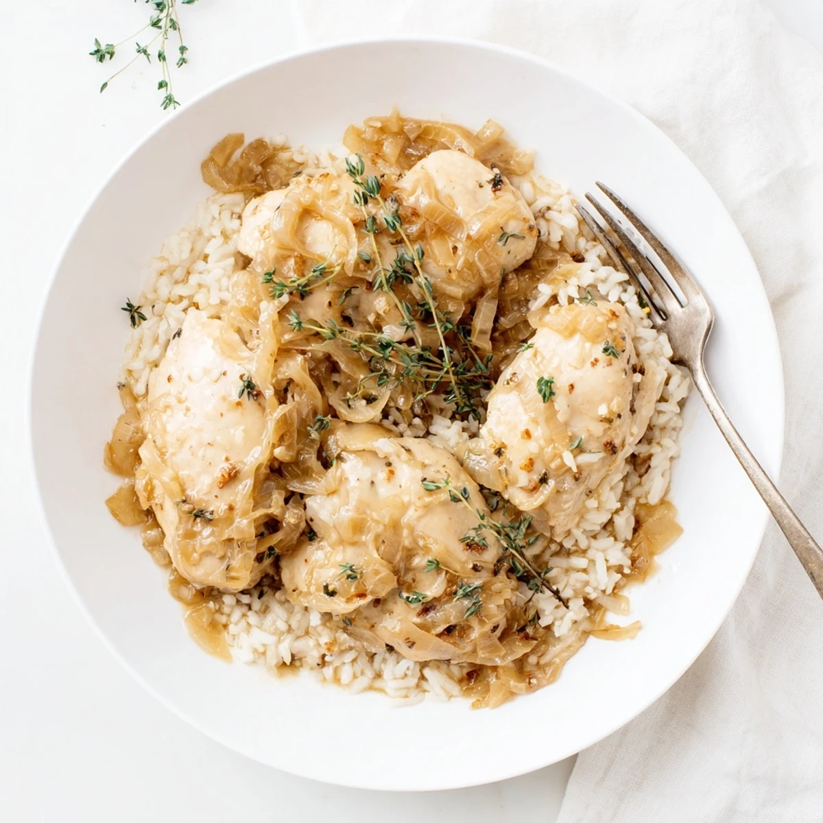 Hearty one-pot French onion chicken features golden seared meat and fluffy rice in savory cream