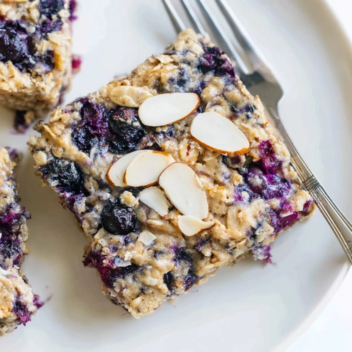 Warm blueberry cottage cheese breakfast bake casserole topped with almonds and coarse sugar for a comforting breakfast