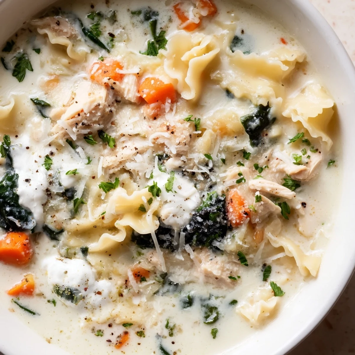 Steaming bowl of Italian White Lasagna Soup with tender chicken, broken noodles, and a rich herby broth