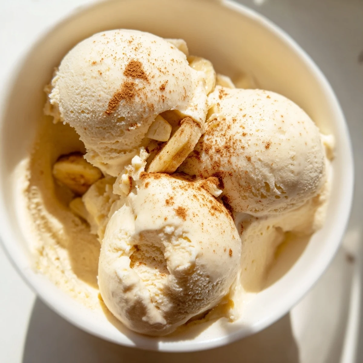 Vegan banana nice cream recipe showing the frozen dessert ready to serve with spoons