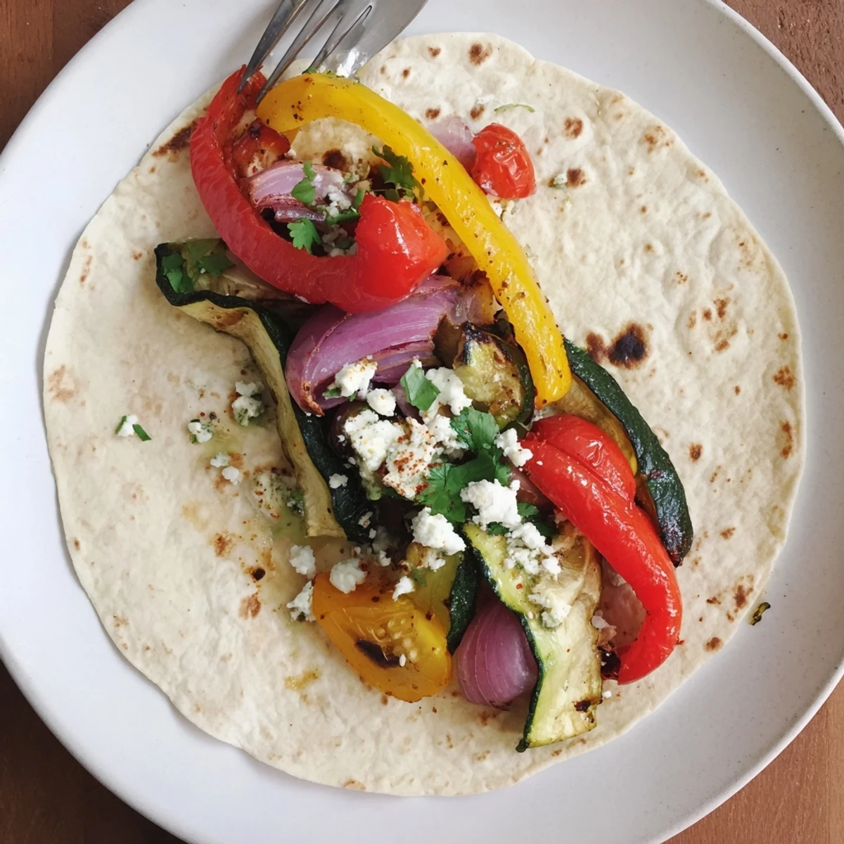 Tajin Feta Sheet Pan Fajitas sizzling with charred peppers, creamy feta, lime